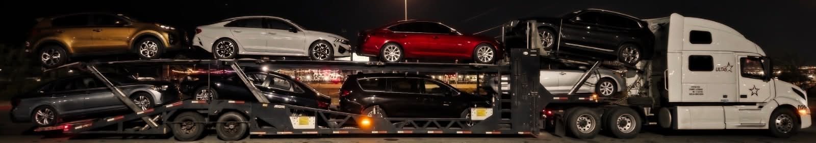 ULTAS car hauler fully loaded at night